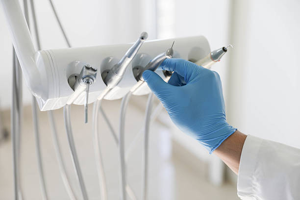 Professional Tooth Extraction technician working in Roosevelt Park, MI
